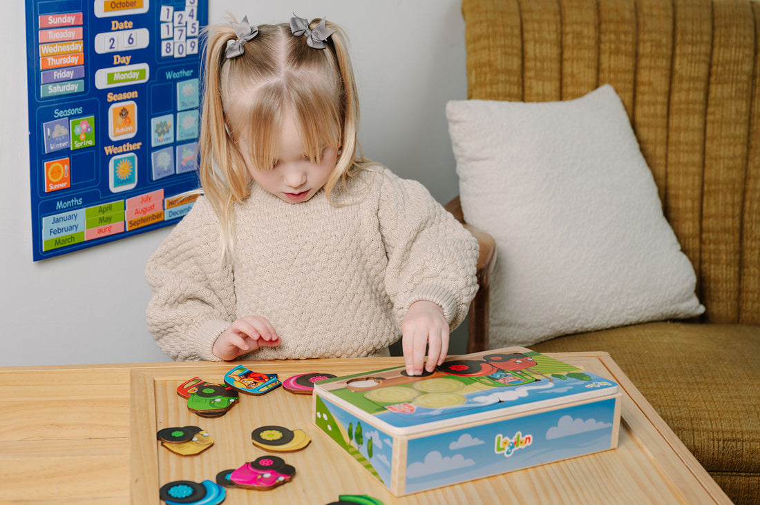 Child playing with a colorful puzzle on a table in a home setting.